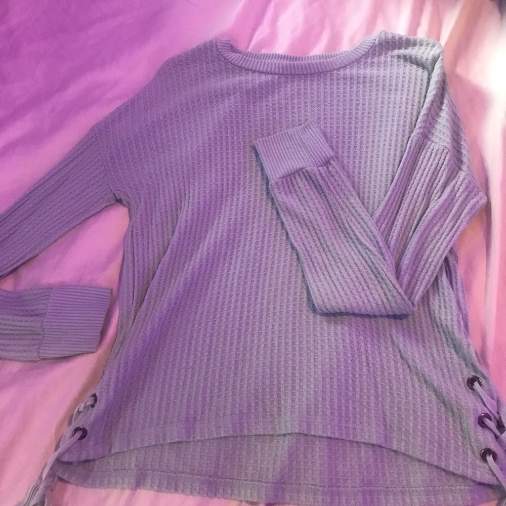 A comfortable teal sweater,soft,and thin!